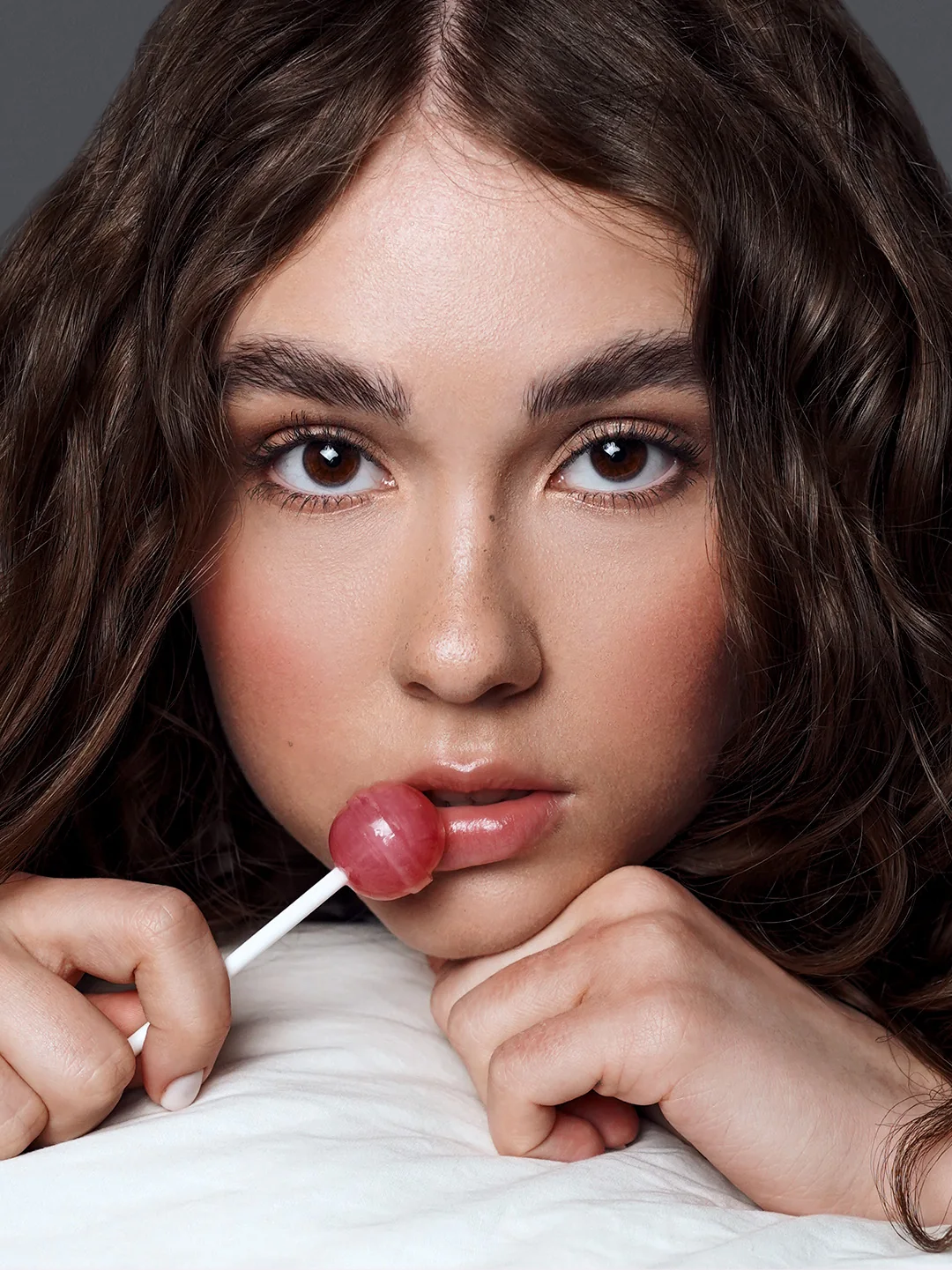 Close portrait with a lollipop