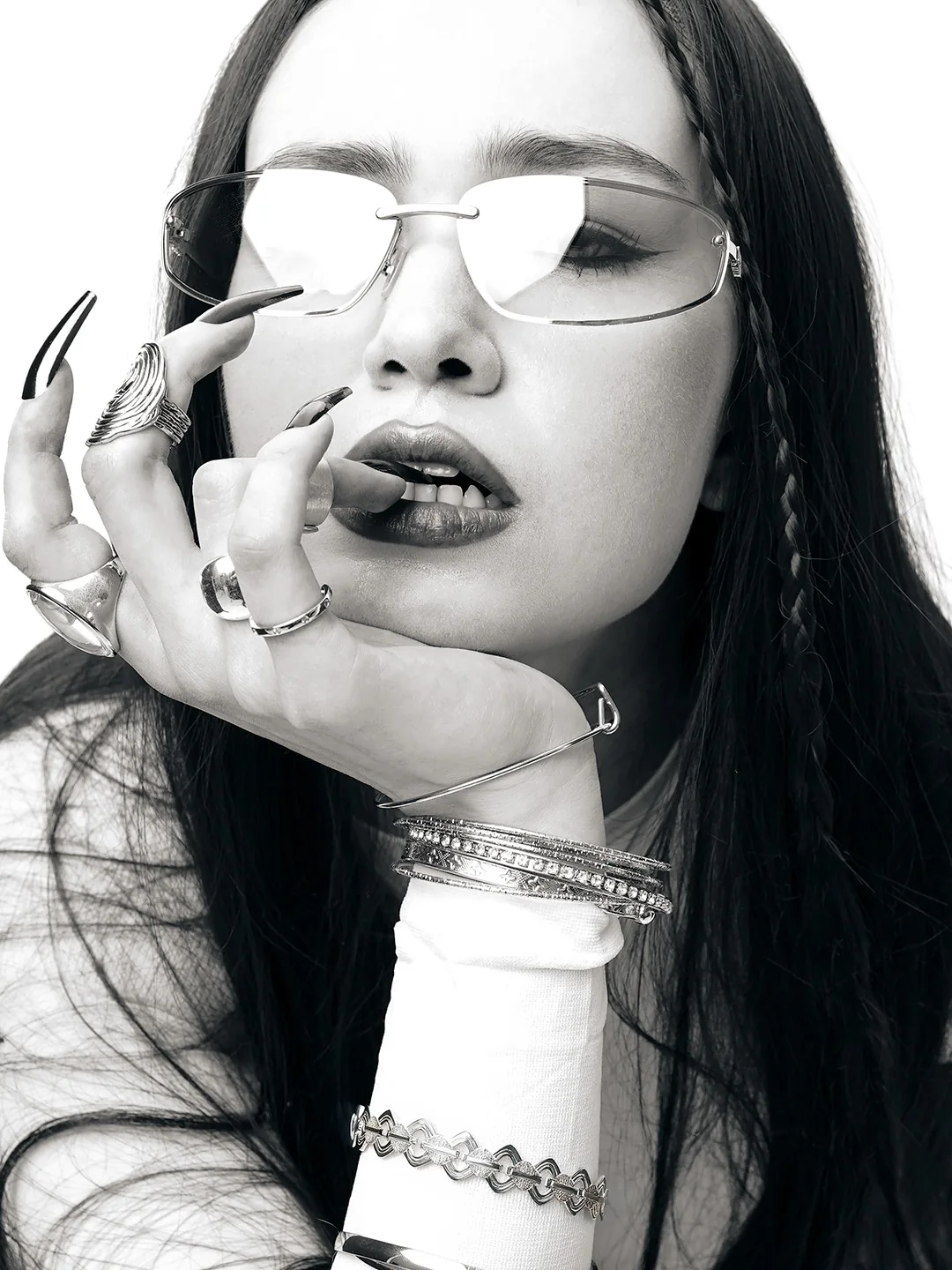 Black and white portrait with glasses and chrome bracelets