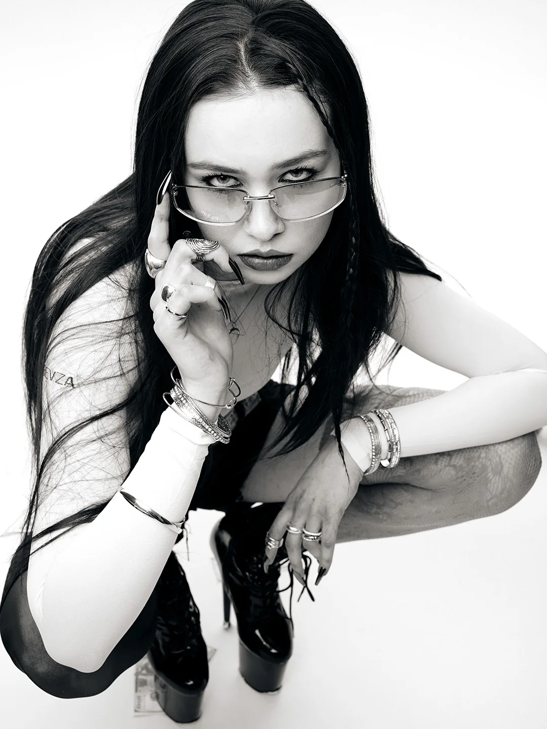 Black and white crouching portrait