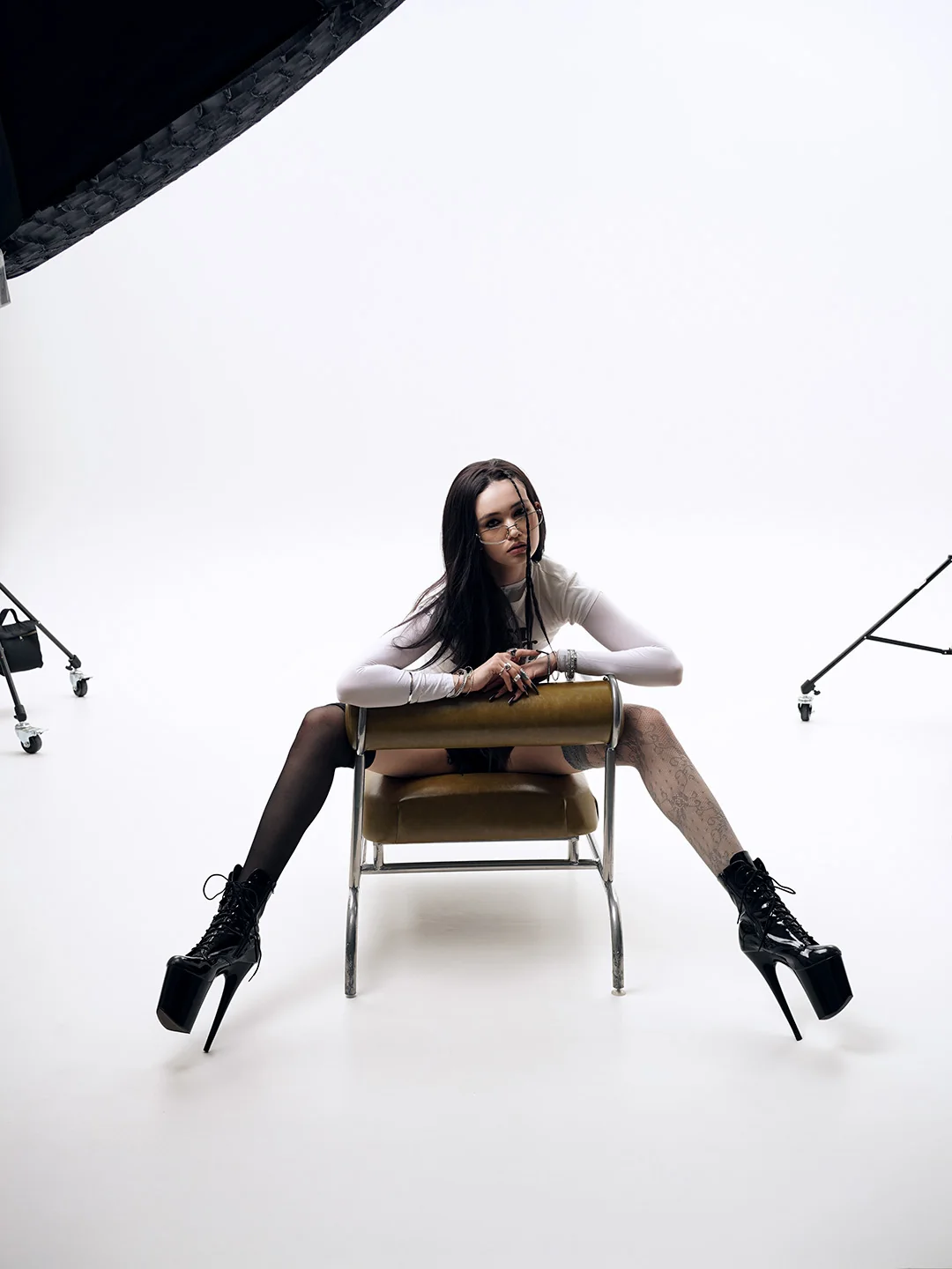 Wide studio shot with chair and equipment